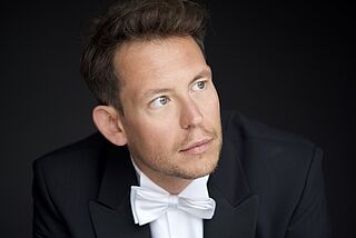 Der Dirigent Daniel Huppert